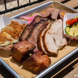 Interstellar BBQ signature dishes Duroc Pulled Pork Shoulder, Prime Brisket, Sliced Brisk brisket Taco.